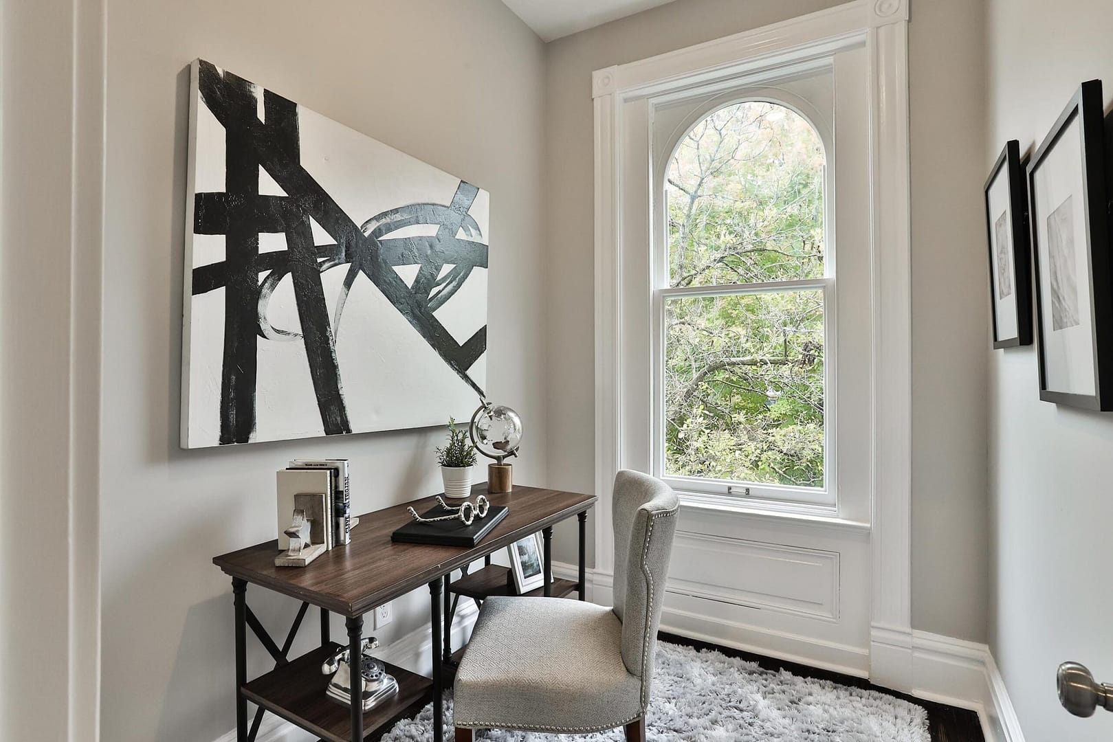 Staged corner office room next to window of South City home in St. Louis, MO