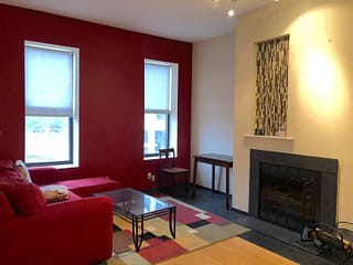 Before shot of room that has not been staged or re-painted, with red walls.